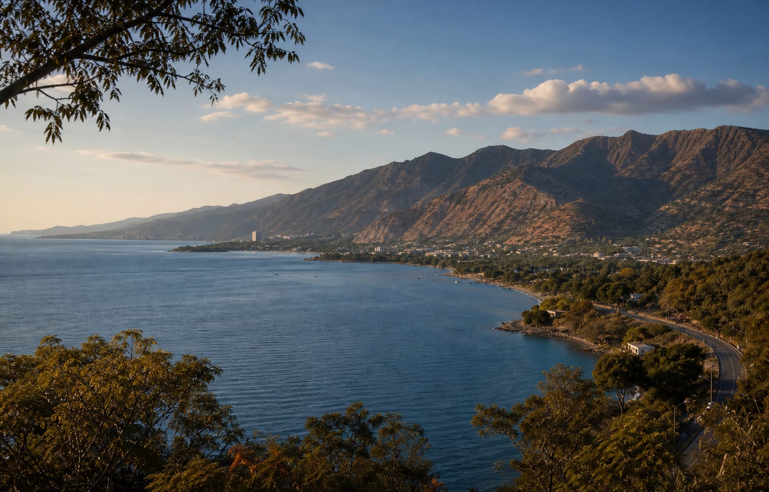 Dili’s coastline curving beneath the mountains beside the Timor Sea